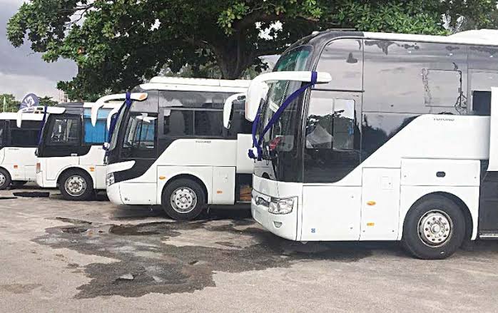 Nigerian intercity coaches parked at a terminal